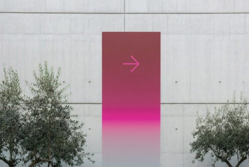 Gradient poster mockup on concrete wall featuring a pink arrow, ideal for showcasing design projects to creative professionals. Perfect for templates and graphics.
