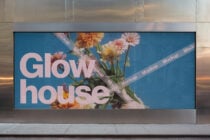 Outdoor billboard mockup featuring vibrant floral design and bold Glow House text ideal for designers. Keywords: Mockup, Billboard, Graphics.