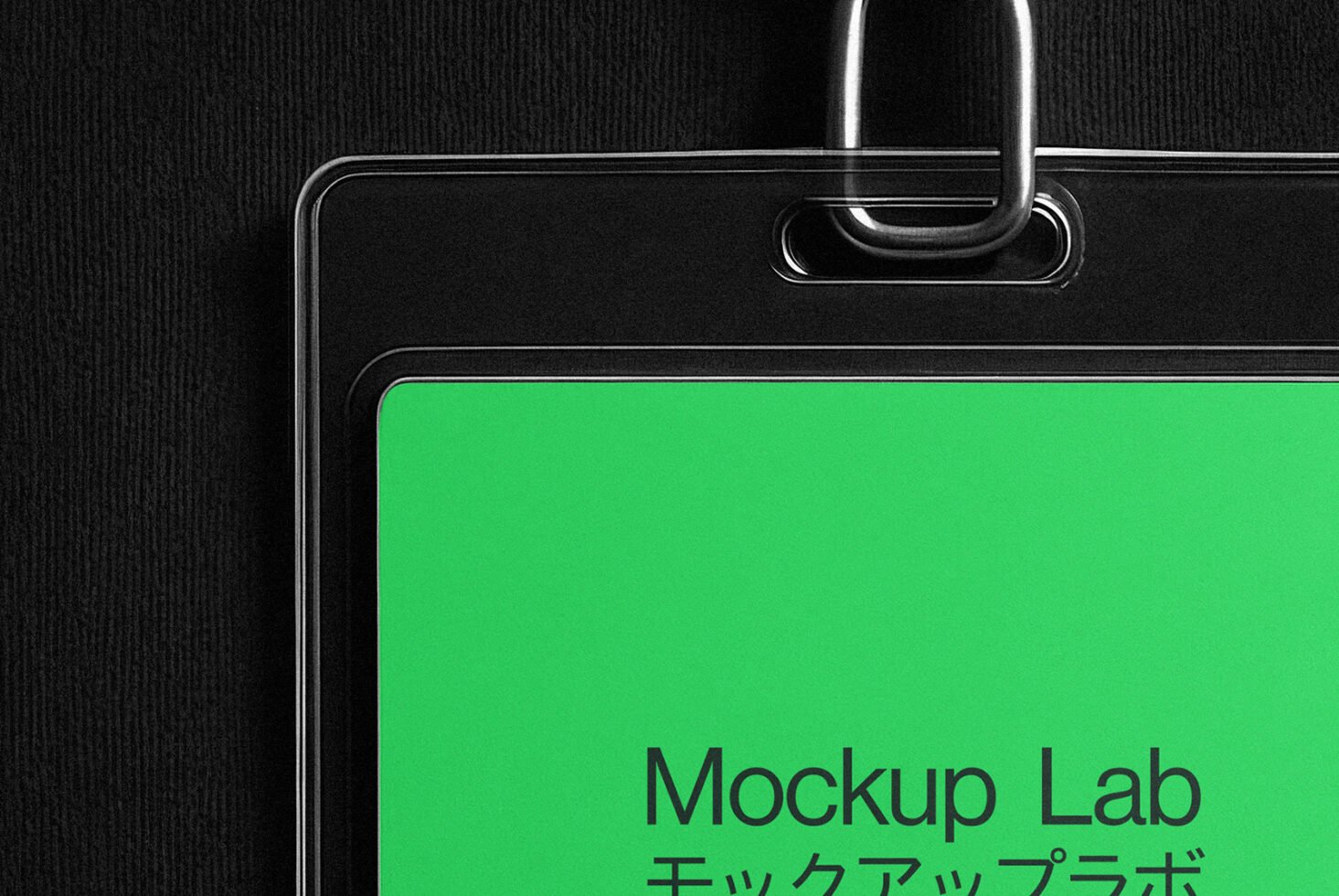 Close-up of a black and transparent badge holder with green card labeled Mockup Lab for office ID card mockups. Ideal for graphic designers templates.