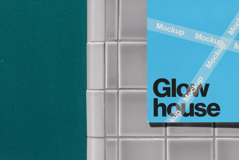 Bright blue poster taped across white subway tiles showing Glow house branding