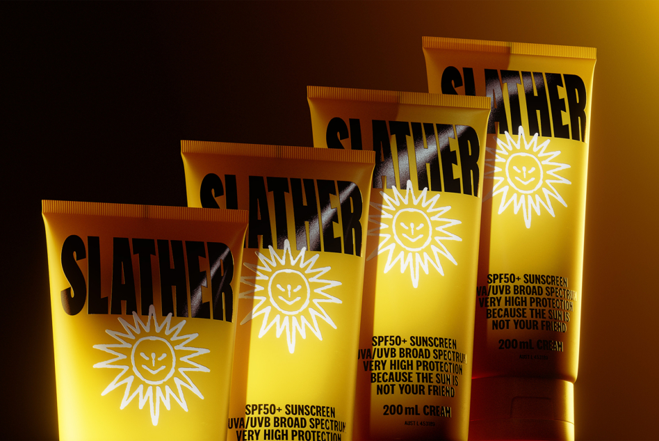 SPF50 sunscreen bottles showing product details on yellow background