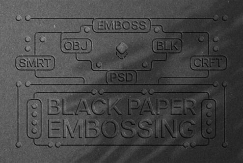 Embossed black paper texture with design elements and text Black Paper Embossing includes keywords SMRT OBJ BLK CRFT PSD suitable for mockups and templates.
