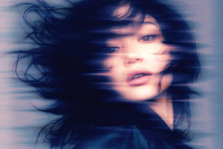 Blurred double exposure effect layering two versions of same face portrait