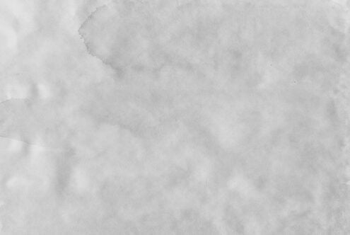 Grunge paper texture background ideal for mockups templates and graphic designs featuring a cloudy gray pattern suitable for designers SEO optimized