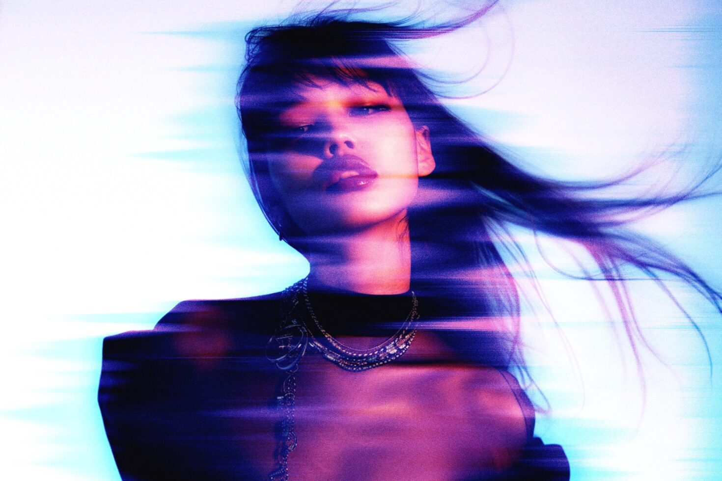 Abstract portrait with neon filters, featuring blurred motion effects and dynamic lighting. Suitable for graphic design projects and digital art templates.