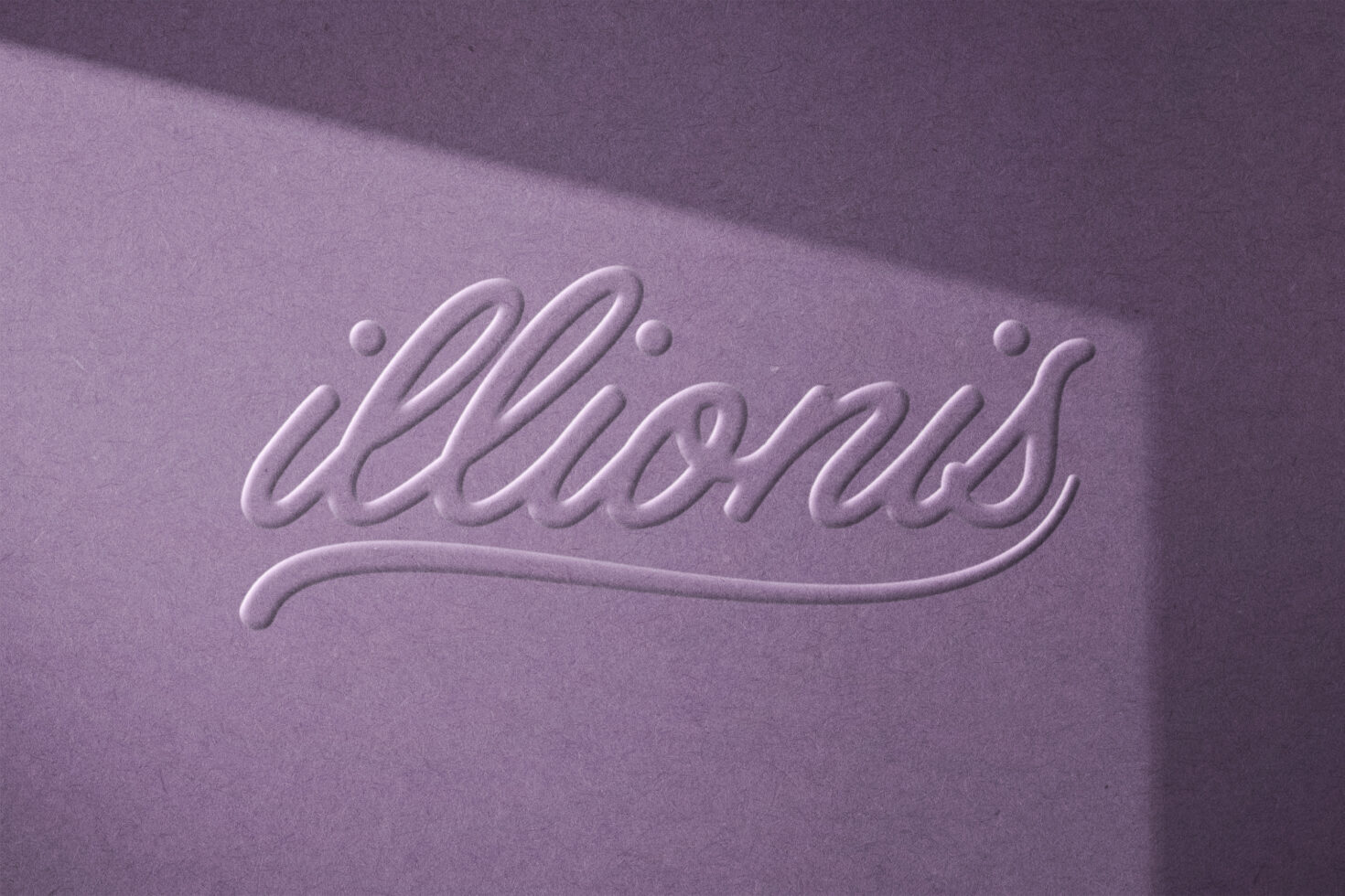 Embossed script typography on purple textured paper background ideal for graphic designers logo mockups font design branding visual assets.