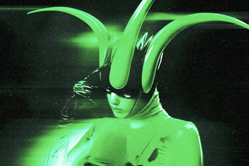 Figure in lime neon bodysuit with sculptural extensions framing the face