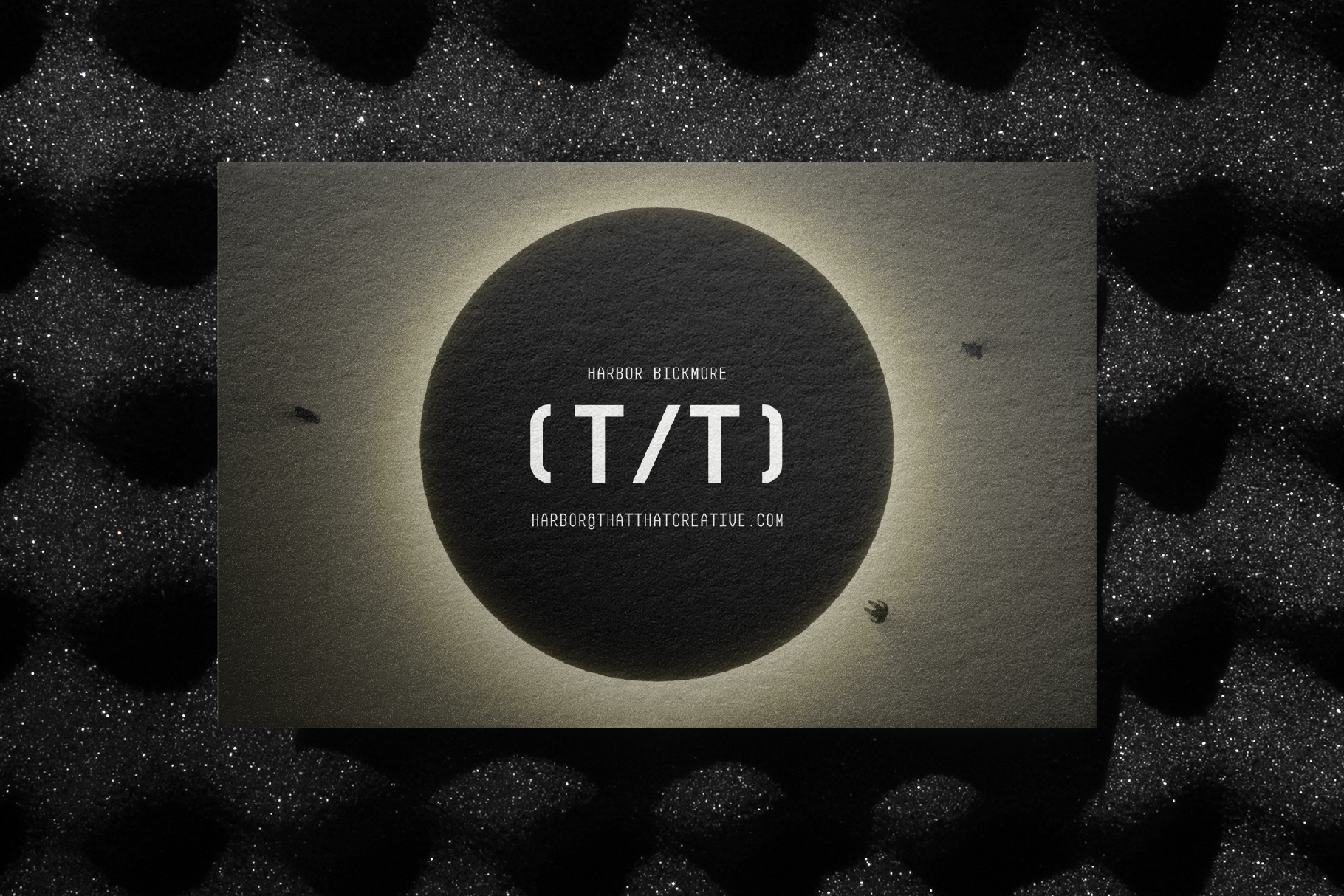Business card mockup with textured dark background featuring modern typography and design, ideal for branding templates and graphic designers.