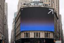 Dark to blue gradient curved billboard with pixel arrow corner, NYC street