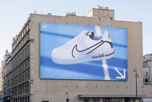 Urban street billboard mockup featuring a large sneaker advertisement with modern design elements. Ideal for graphic designers and advertising templates.
