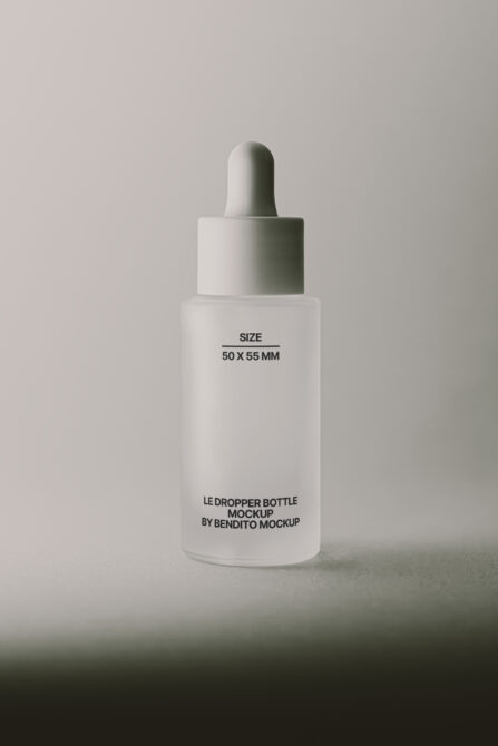 White dropper bottle with white cap on neutral beige background