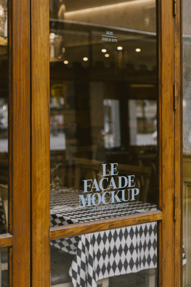 Facade mockup display on a rustic wooden window with geometric patterned tablecloth inside, perfect for showcasing store signage design templates.