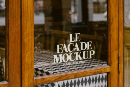 Wide shot of wooden storefront doors with window mockup display
