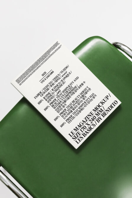 White woven label mockup on green fabric with size specifications