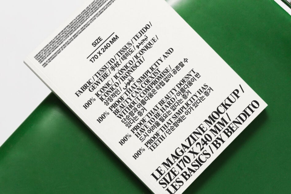 White fabric label on green textile with composition details visible