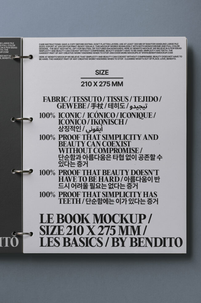Le Book Mockup featuring bold typography in multiple languages on a page. Ideal for designers seeking stylish, versatile print template presentation.