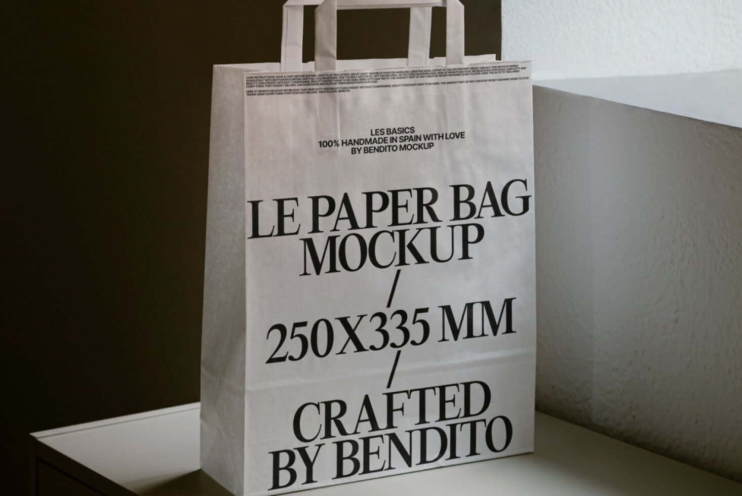 Paper bag mockup template 250x335 mm with bold text design placed on a table ideal for showcasing graphic design projects and branding concepts