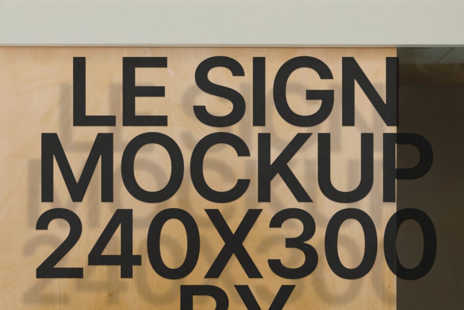Bold black text sign mockup displayed on weathered wooden interior wall