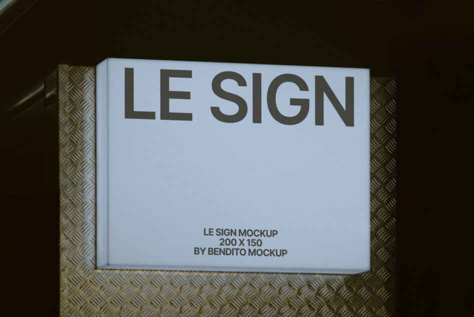Angled view of framed sign mockup with light blue background on metal