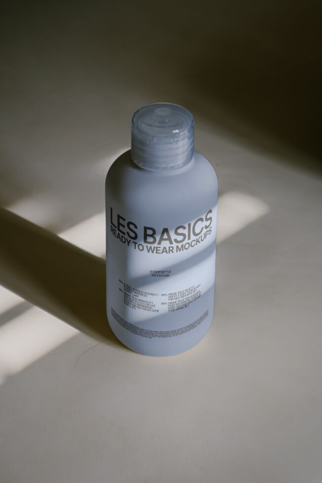 Mockup of a matte bottle with minimalistic design ready for labels or branding in striking lighting ideal for showcasing packaging mockups for designers