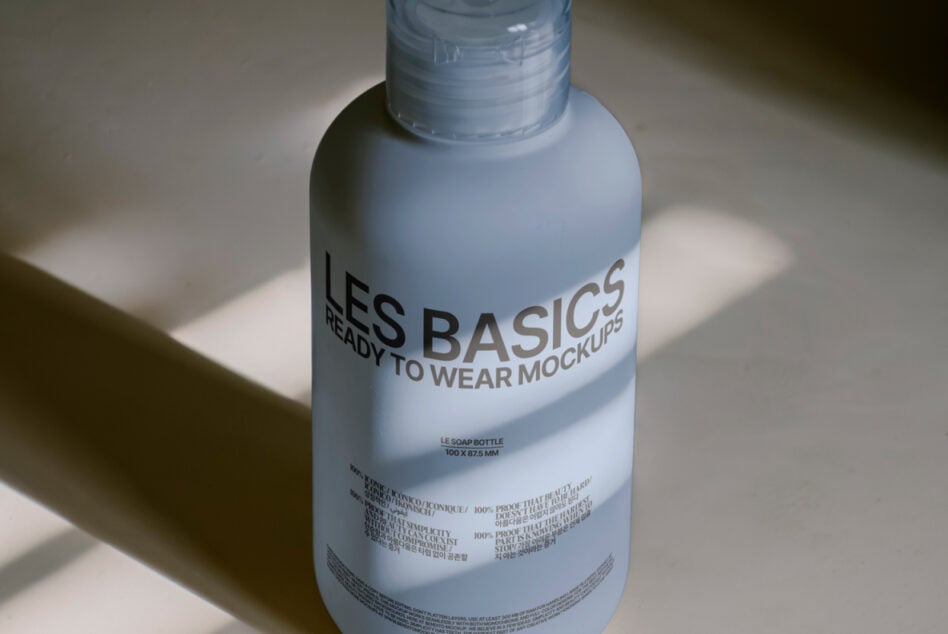 Blue soap bottle tilted angle showing label clarity with studio lighting effect