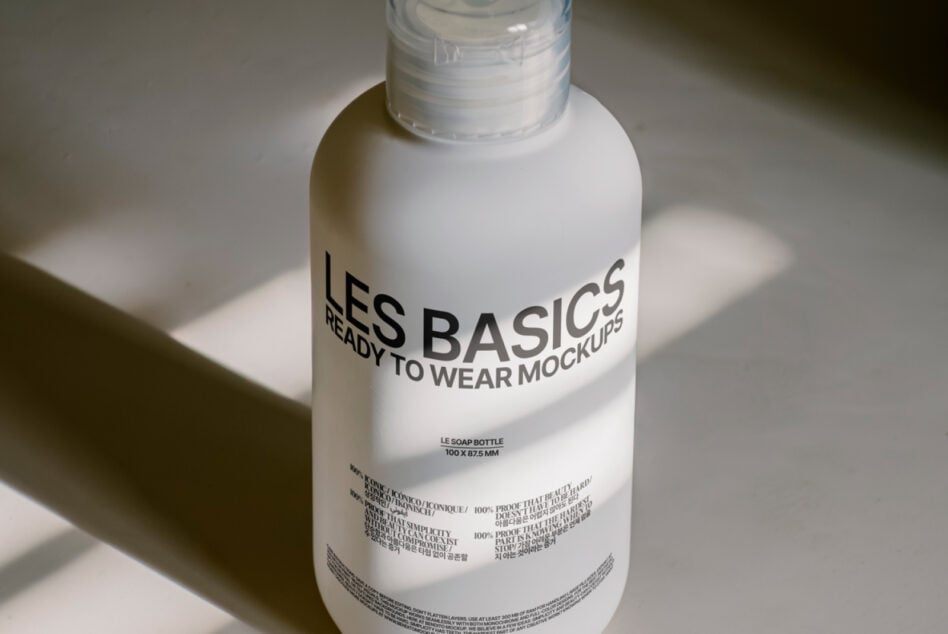 White soap bottle with clean label layout catching studio light from above