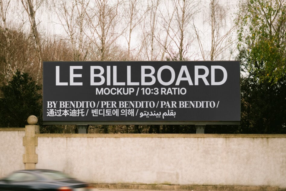 Horizontal roadside billboard with black background, white sans-serif text, bare trees behind