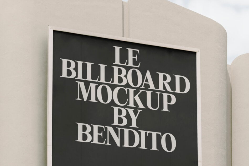 Close-up horizontal billboard on cream building with black background, white serif text centered