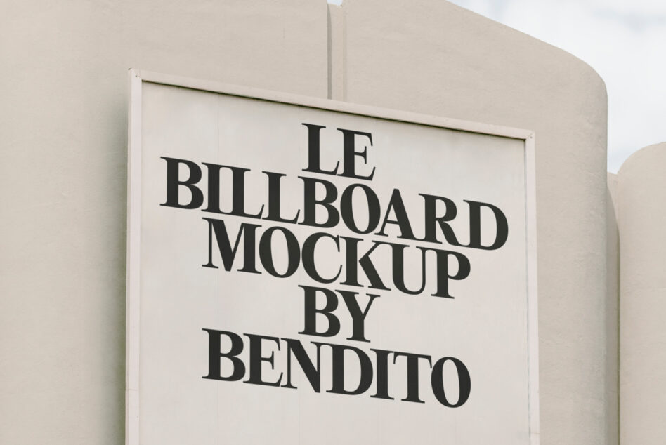 Close-up horizontal billboard on cream building with white background, black serif text centered