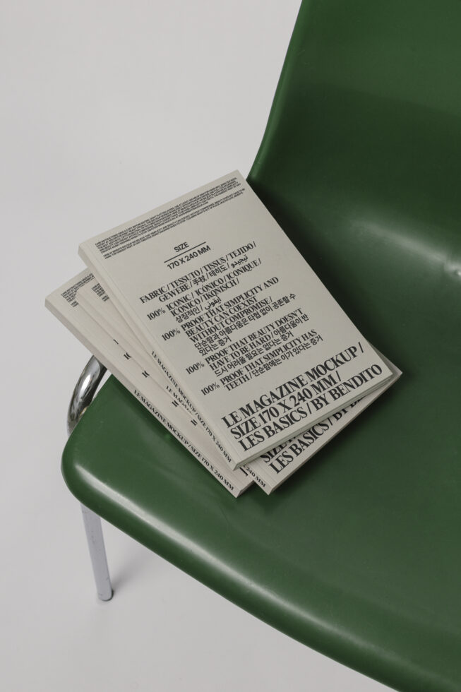 Magazine mockup with modern typography rests on a green chair. Ideal for showcasing editorial design. Keywords: magazine mockup, typography, editorial design.