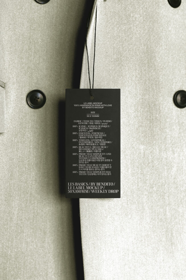 Clothing label mockup on beige coat with black buttons design resources for fashion branding template designers digital asset 50x100mm realistic tag