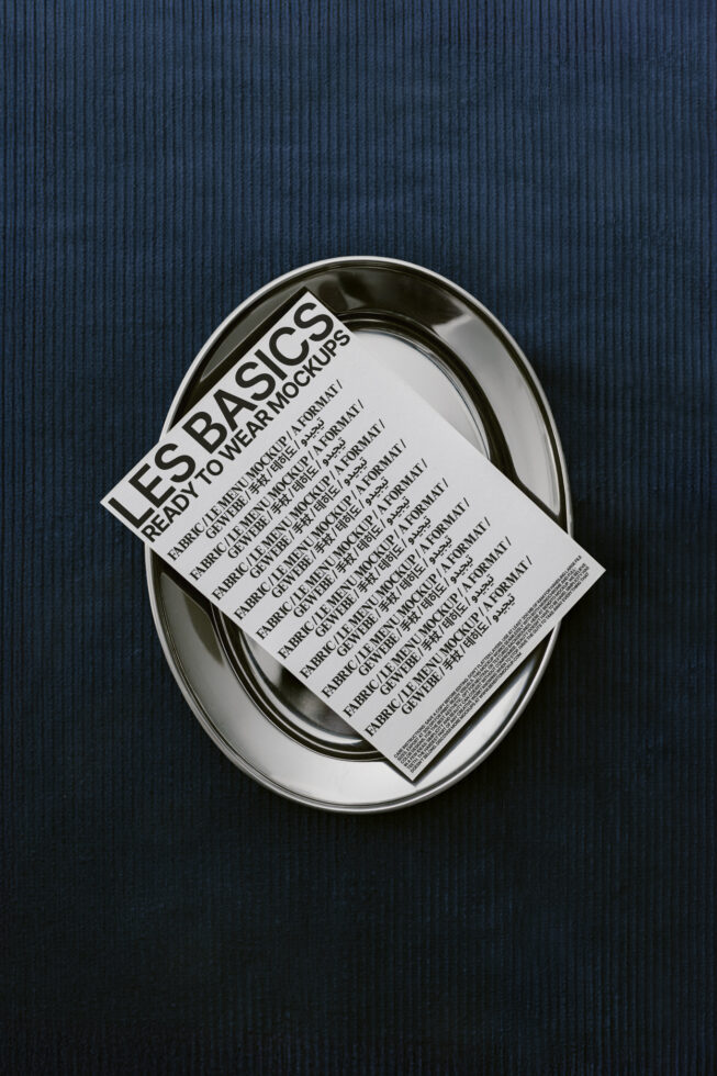 Les Basics mockup with text overlay on a silver plate on deep blue cloth. Ready to wear branding. Mockup design templates for graphic designers.