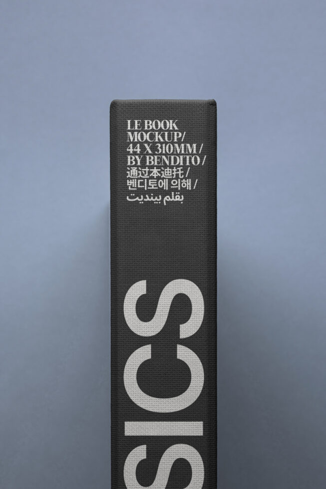 Book spine mockup with multilingual text and simple design on black canvas background. Ideal for graphic designers and template creators.