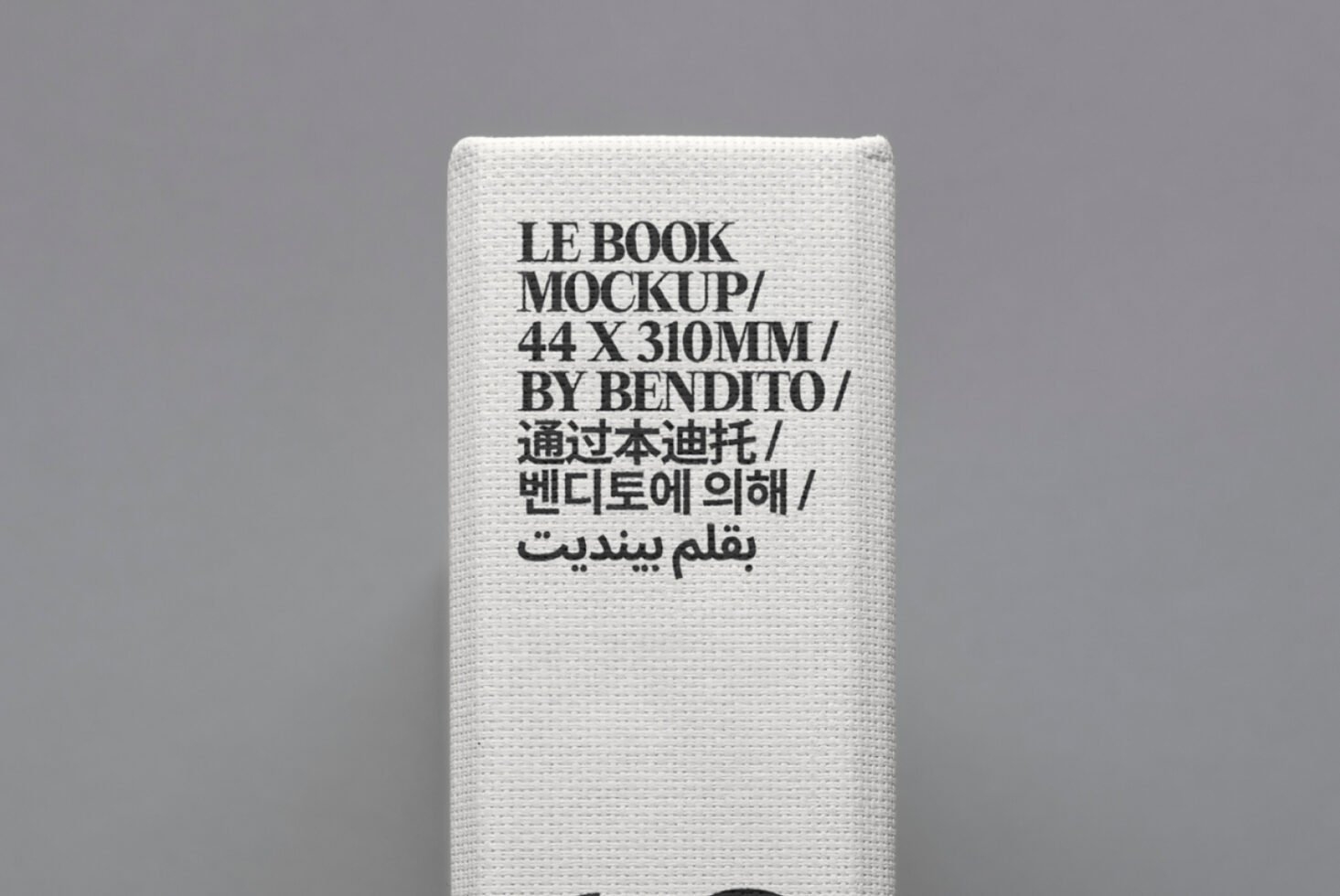 Book spine mockup with multilingual text on canvas texture in close-up. Ideal for graphic design, template, or mockup projects.
