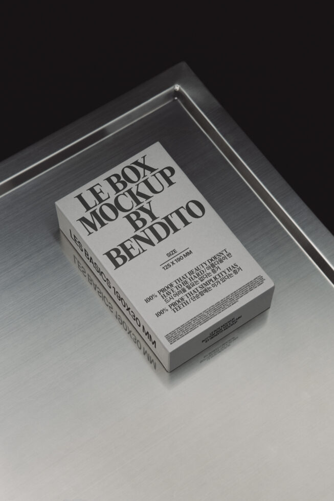 Minimalistic box mockup on a metallic surface ideal for showcasing packaging designs. Perfect for designers creating realistic product presentations.