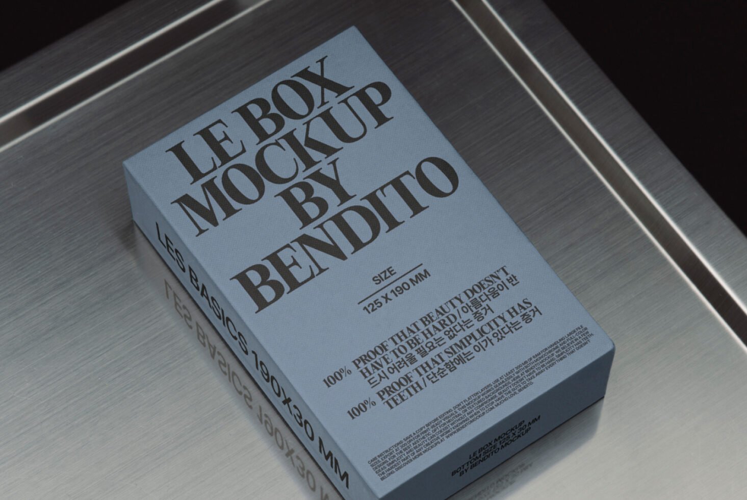Blue box packaging mockup on metallic surface showcasing branding design. Perfect for designers seeking realistic presentation. Keywords: Box Mockup, Design.
