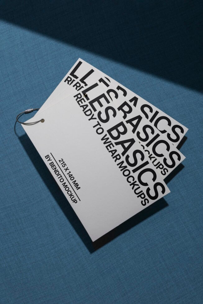 Minimalistic clothing tag mockup on textured blue background showcasing design layout ready for branding and graphic projects for designers.