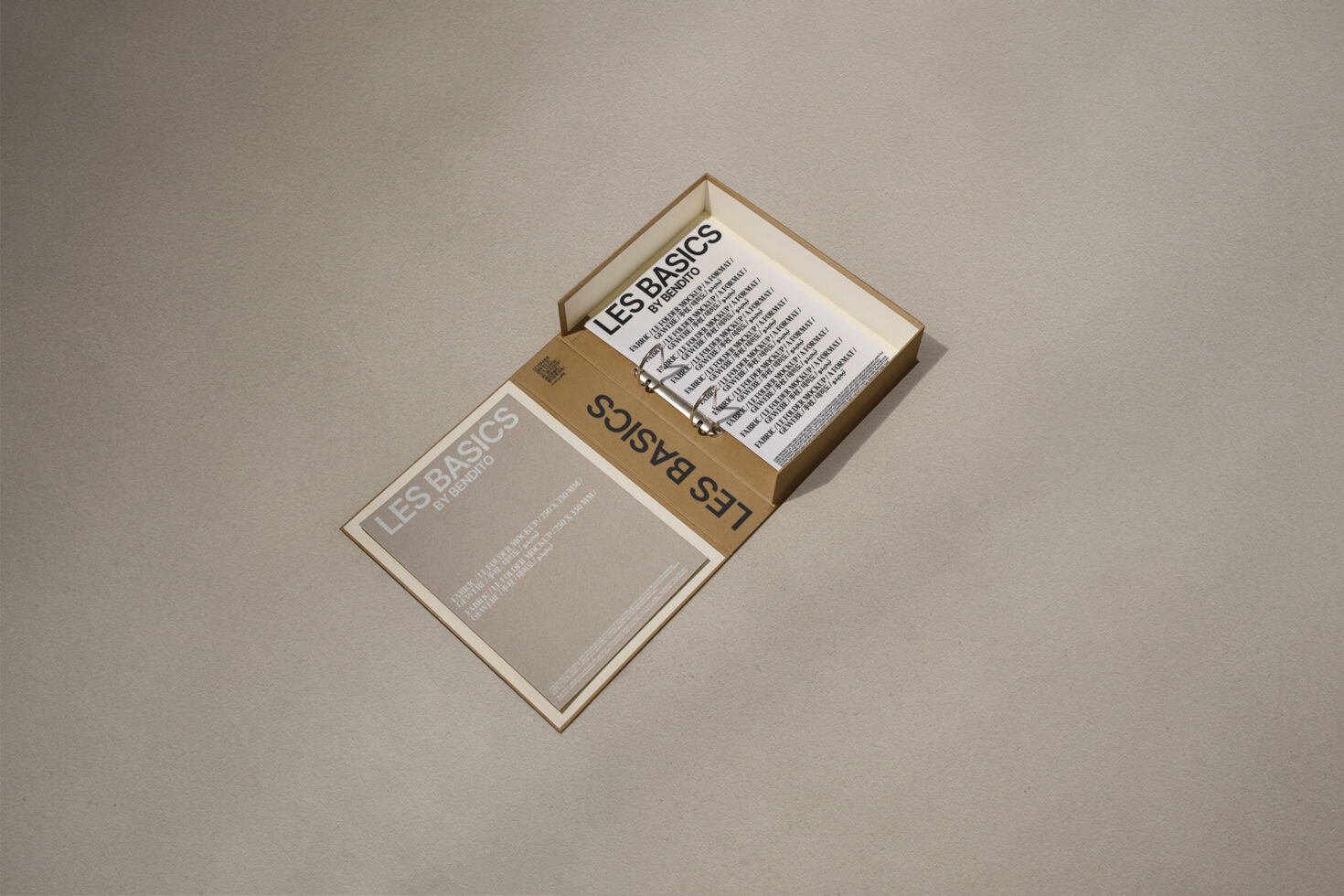 Open brown box with a minimalist design on a textured background showcasing typography samples titled Les Basics ideal for designers seeking modern fonts.