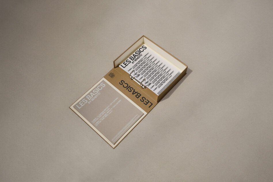 Open brown box with a minimalist design on a textured background showcasing typography samples titled Les Basics ideal for designers seeking modern fonts.