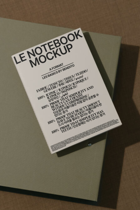 White notebook mockup on sage green paper with multilingual text