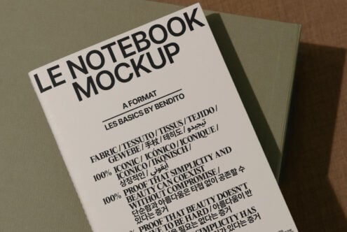 Notebook mockup featuring bold typography on a fabric cover suitable for graphic and template design. Ideal for design presentations and layouts.