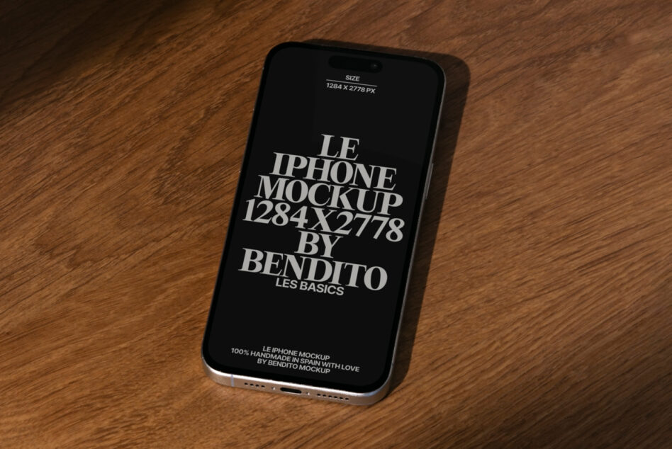 Black iPhone mockup with white text on wooden surface, angled right