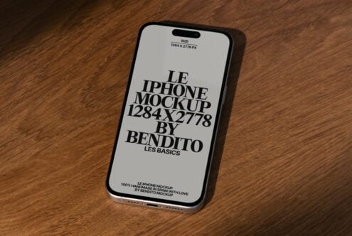iPhone mockup displayed on wooden surface showcasing dimensions 1284x2778 by Bendito Les Basics ideal for designers mockups digital asset SEO.