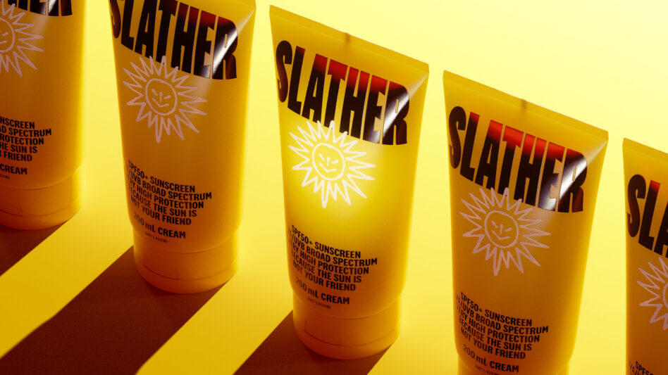 Yellow sunscreen tube mockup with bold text design labeled SLATHER featuring protective sun icon SPF50 broad spectrum sunblock ideal for graphic designers.