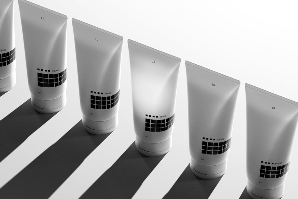 Monochrome 3D product mockup featuring a line of minimalist tubes with grid design perfect for branding and packaging templates for designers.