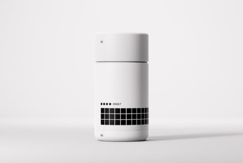 Minimalist product mockup featuring a modern white container with black grid design on a neutral background perfect for branding and packaging projects.