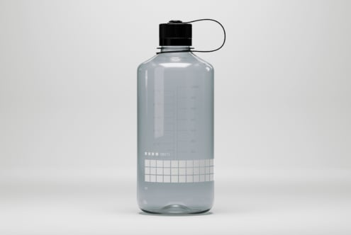 Minimalist water bottle mockup in transparent design featuring a black cap with a loop. Ideal for branding presentations or product packaging concepts.
