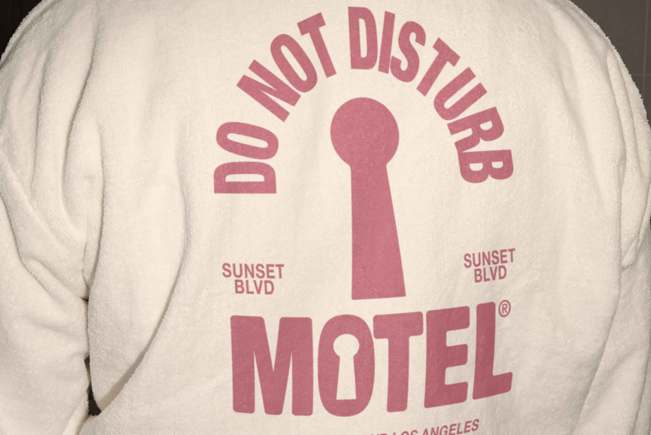 Cream sweatshirt back with dusty rose keyhole motel vintage style graphic