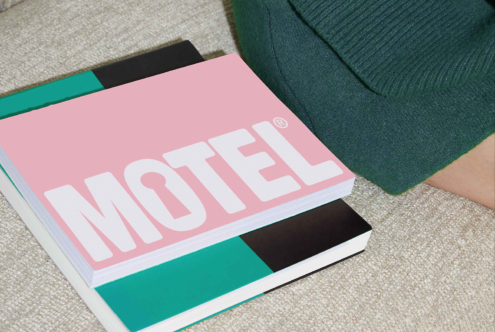Pink and teal booklet with bold Motel text, ideal for graphic design mockups and templates. Minimalist aesthetic for creative branding projects.