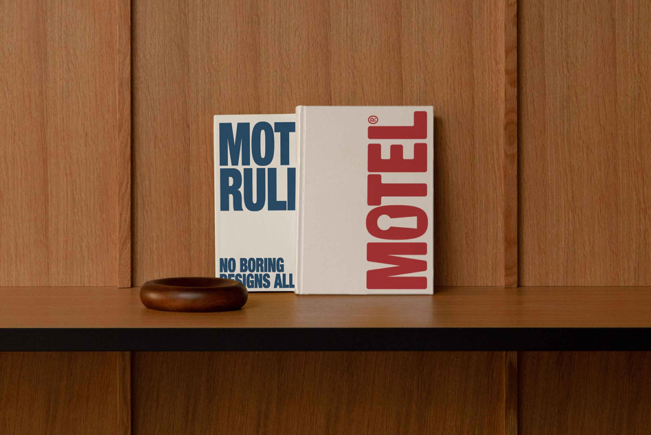 Square hardcover book mockup in red on wood shelf with wooden bowl
